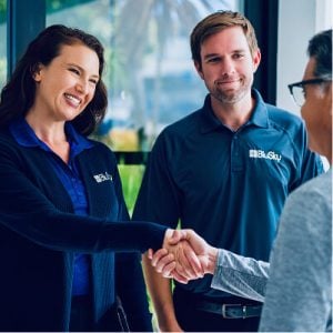 businesswoman shaking hands with customer