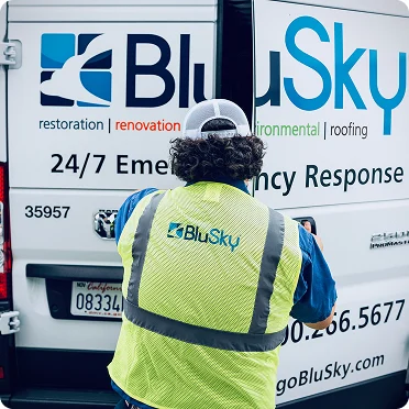 BluSky staff member closing door of work truck