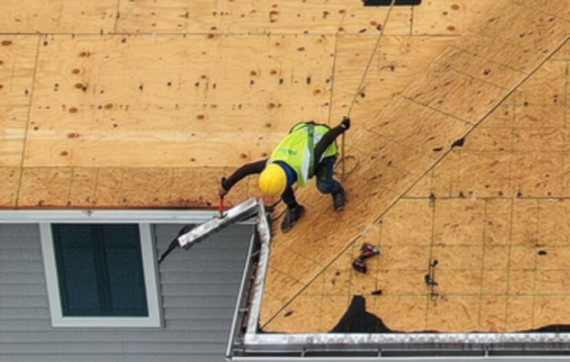 BluSky employee performing roofing service for hospitality group in Branson, MO