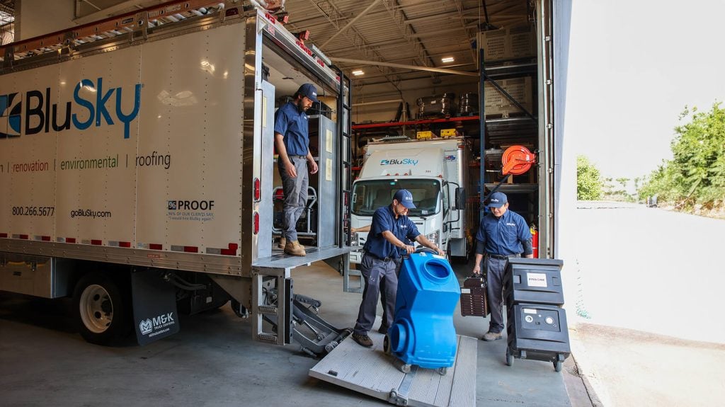 multiple men getting equipment off Blusky truck