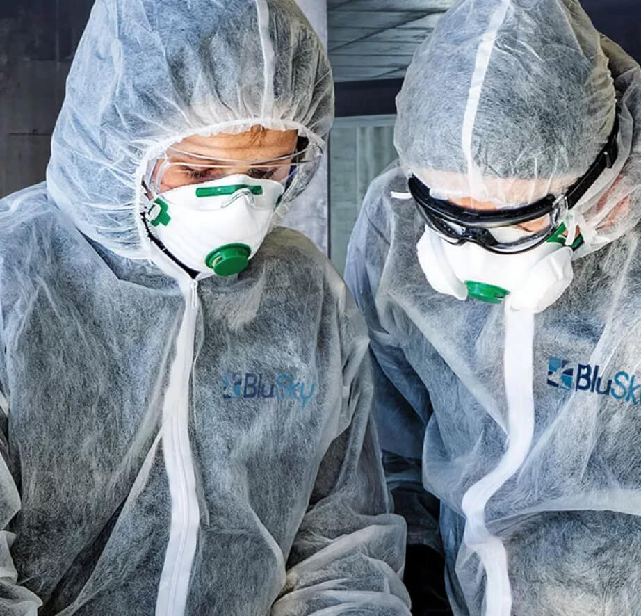two blusky employees inspecting mold