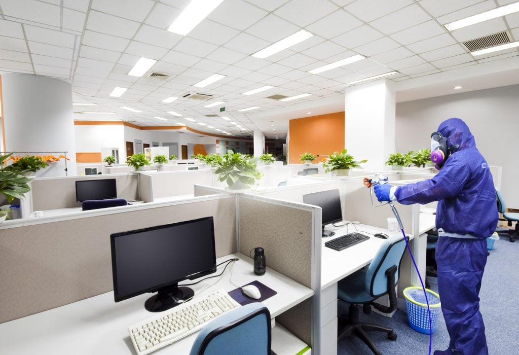 blusky employee disinfecting office building