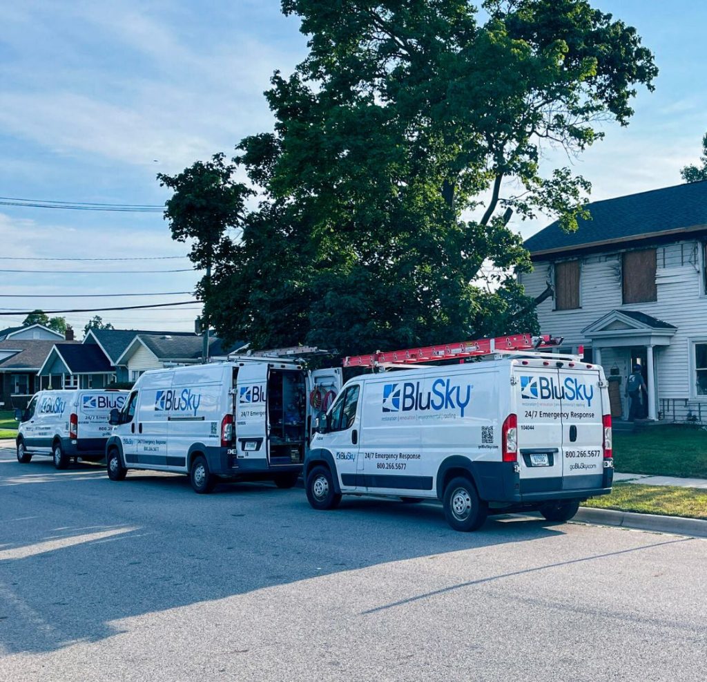 BluSky work trucks parked on residential street