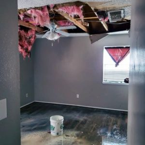 bedroom with mold in the ceiling