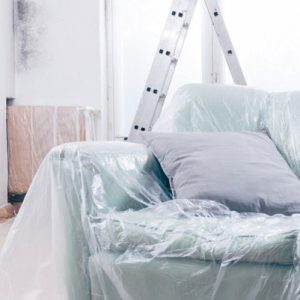 couch and floor in protective covering