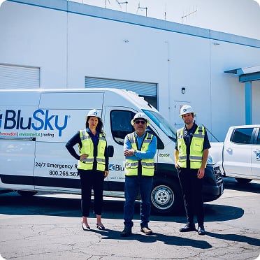 BluSky staff members in front of work truck