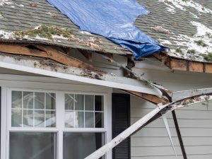 close-up of storm damage to residential house