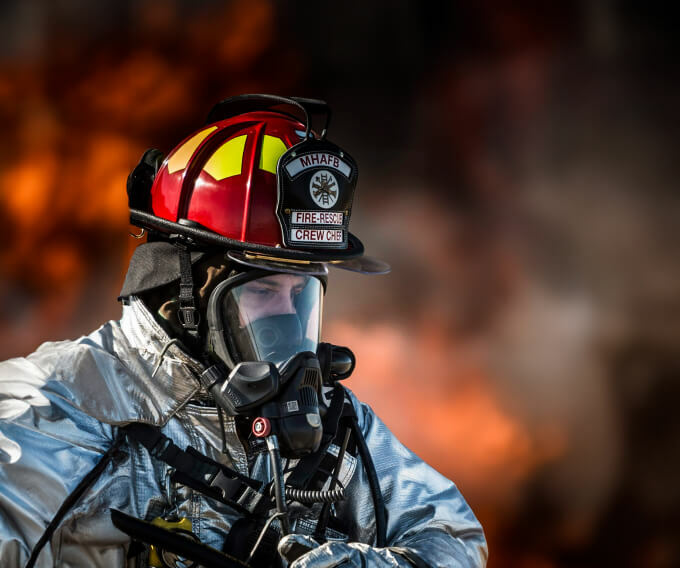firefighter wearing helmet and mask