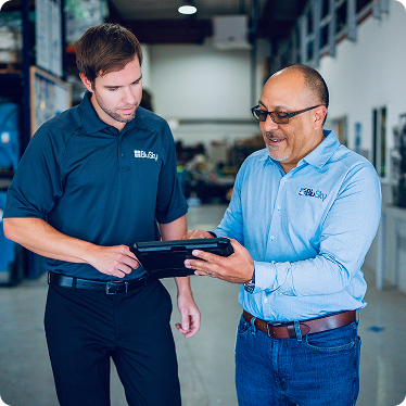 BluSky staff members reviewing tablet