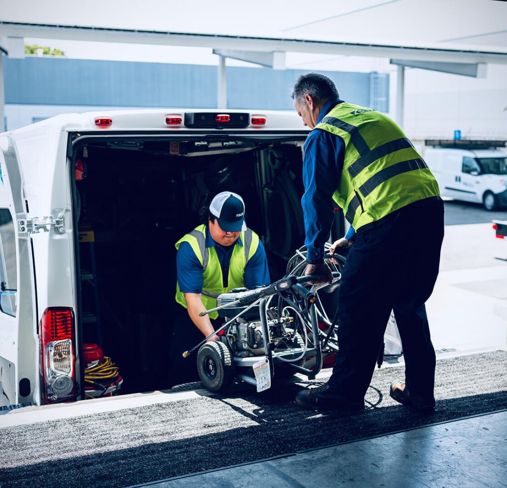 BluSky staff loading equipment into work truck